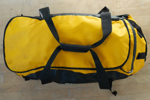 Thule_Chasm-Medium_water-resistant-convertible-duffel-bag_Zinnia-yellow_compressed-worn-top