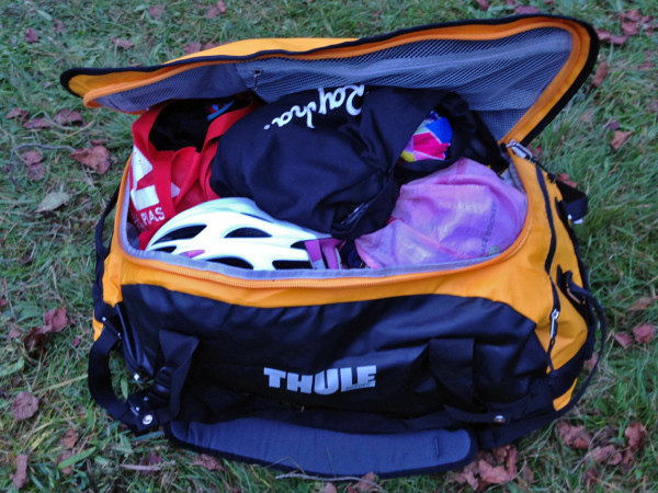Thule_Chasm-Medium_water-resistant-convertible-duffel-bag_Zinnia-yellow_wet-packed-open