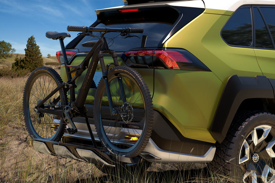 Toyota FT-AC adventure concept vehicle SUV with integrated bike rack and mountain bike trail lights