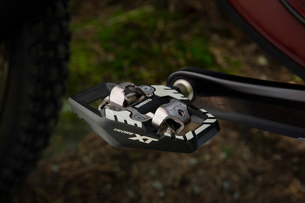 new XT M8100 trail pedals have a larger platform to better support your shoes and feet