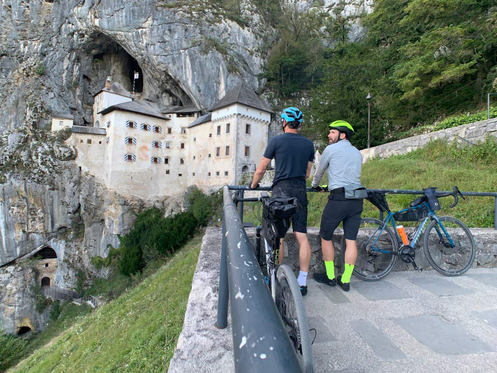 riding bikes to predjama castle in slovenia