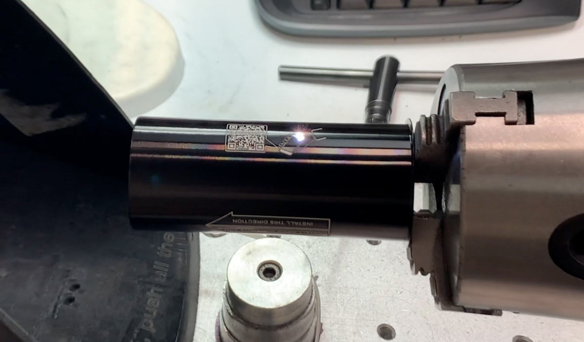 laser etching the logo and specs onto a one piece bottom bracket shell