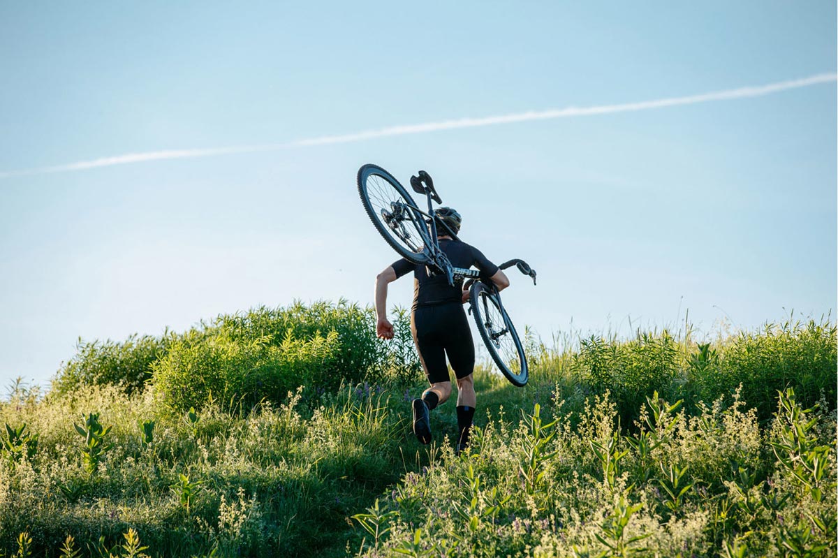 giant cyclocross race bike running up a hill
