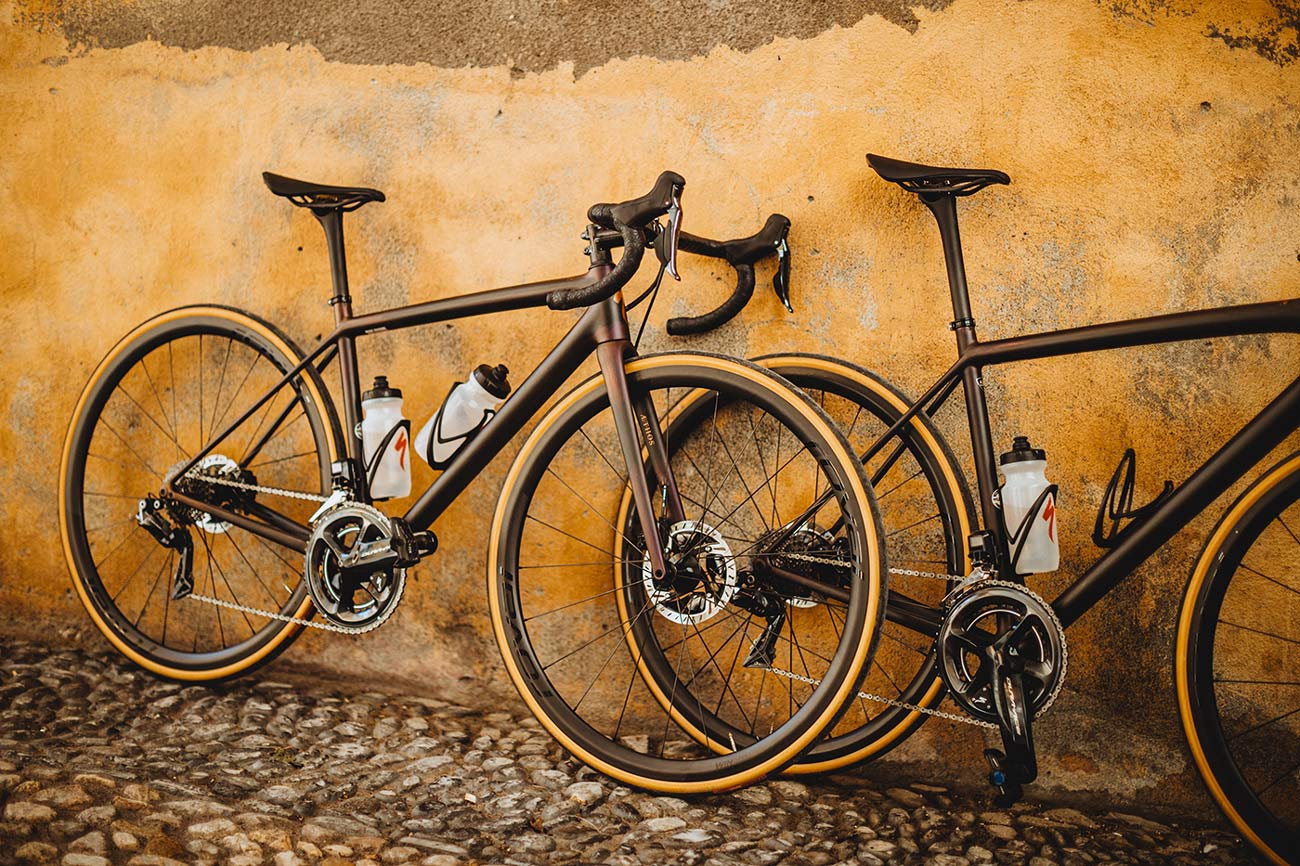 specialized aethos s works road bikes leaning against a wall