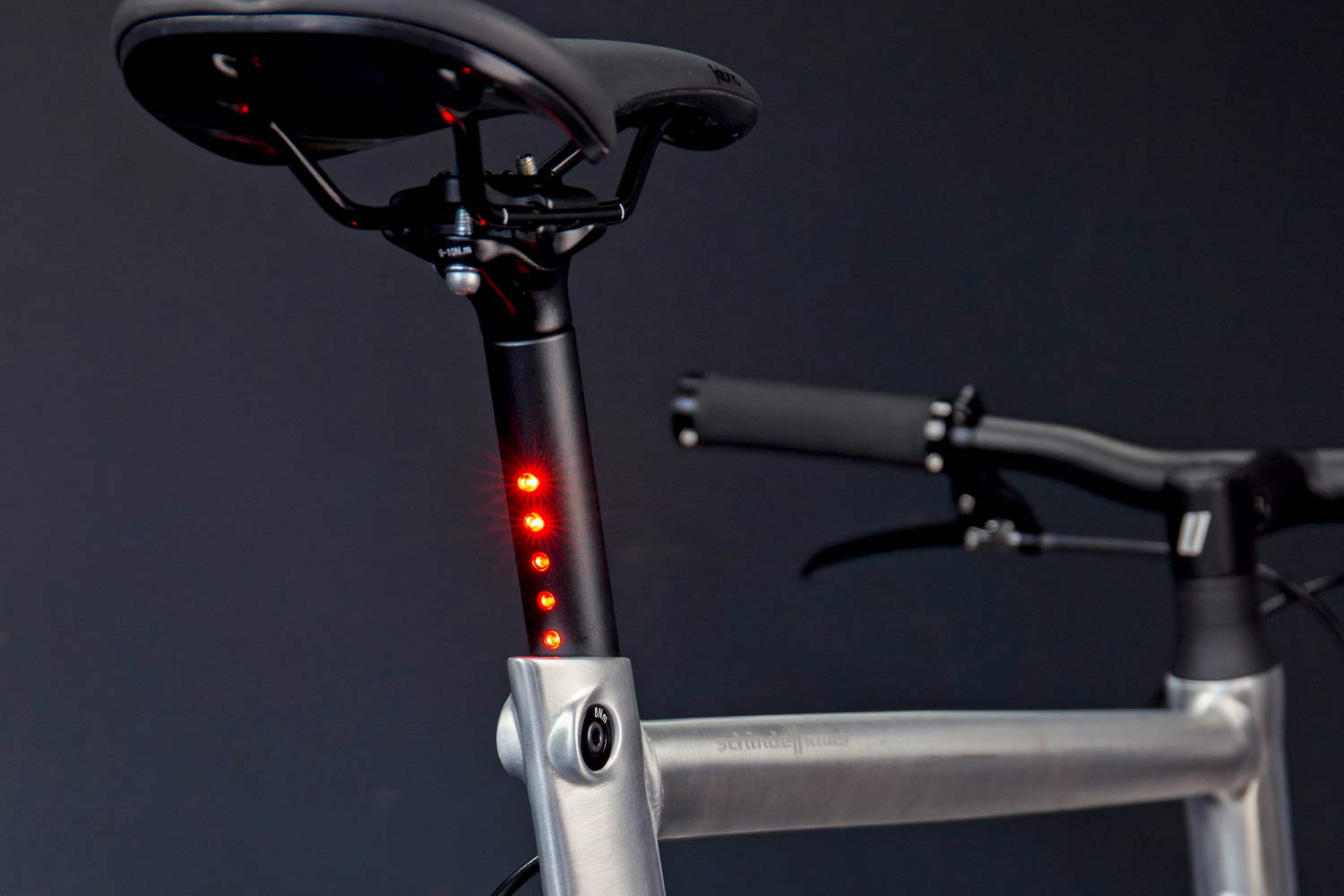 LightSKIN integrated commuter bike headlight taillight, StVZO-certified hidden internal LED seatpost handlebar lighting, post on
