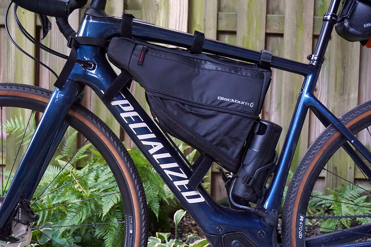 blackburn outpost frame bag shown in open expanded position to hold more bikepacking gear