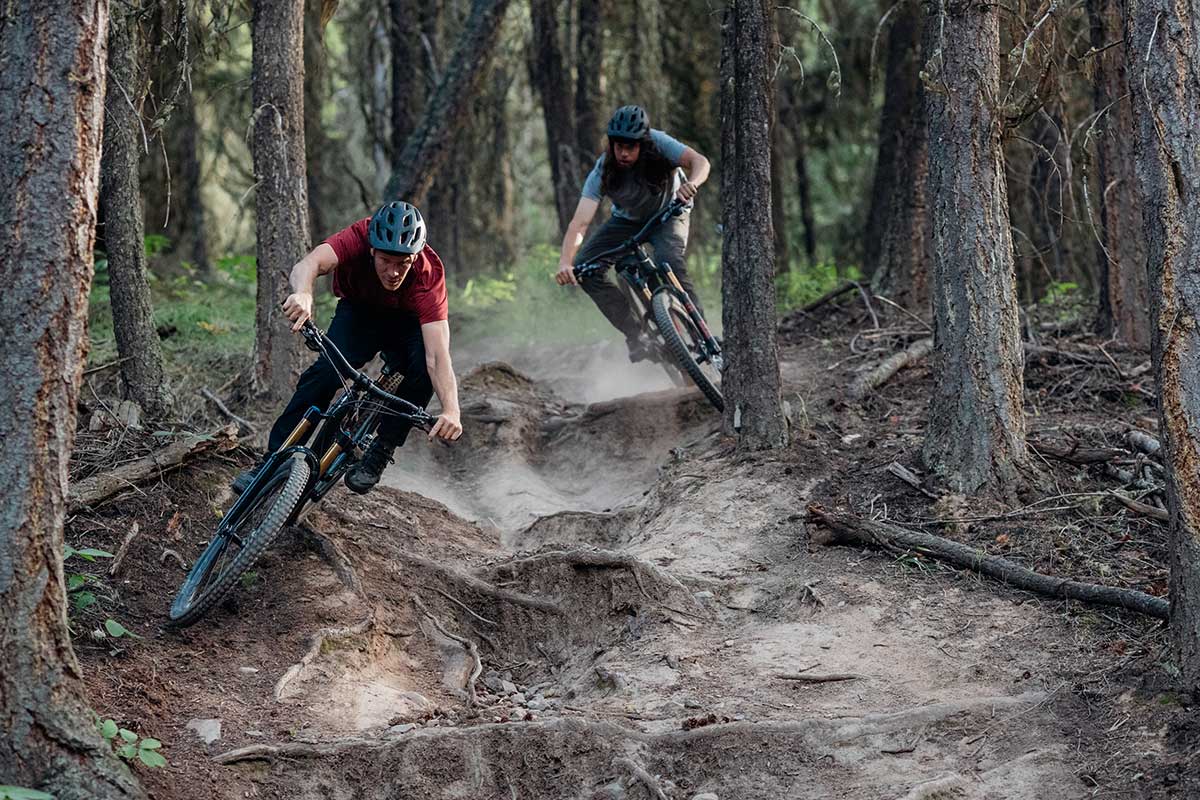 two male mountain bike riders shred dusty rooty trail highlines aboard new stumpy 150mm trail bike