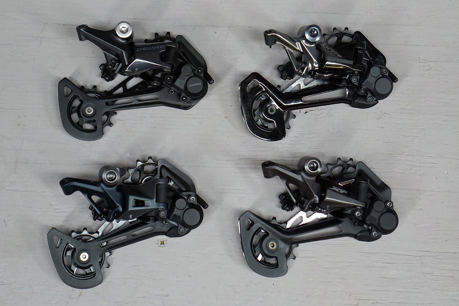 all four shimano 12 speed MTB rear derailleurs compared side by side