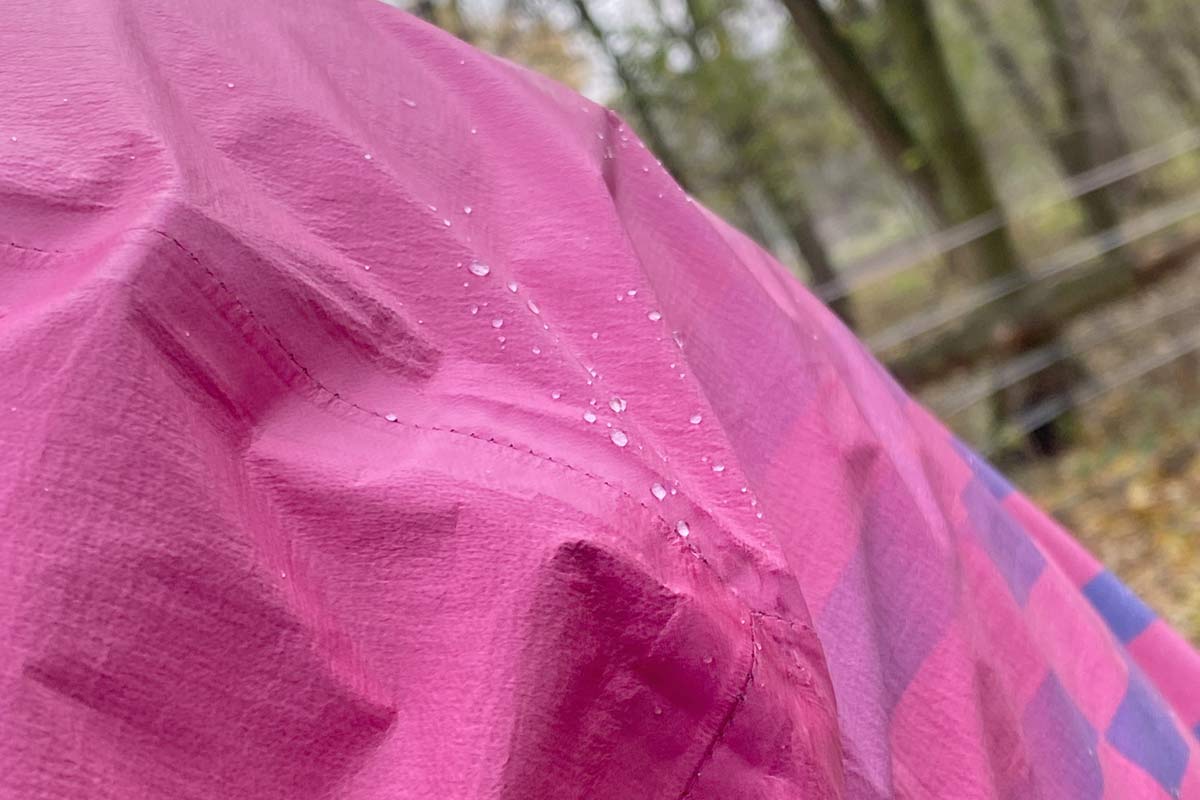 Exclusive Review: Rapha Pro Team Lightweight Gore-Tex Jacket printed in pink Technicolor, extra full color Shakedry visibility, shake the rain away