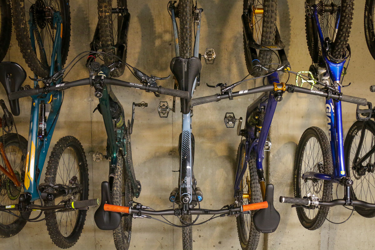 Hanging mountain bikes upside down on a storage hook
