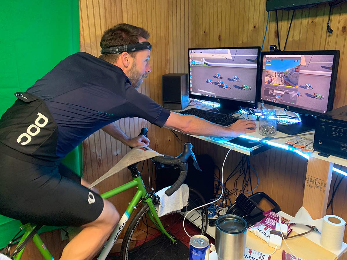 rider setting up rouvy indoor cycling app on home computer for cycling training inside
