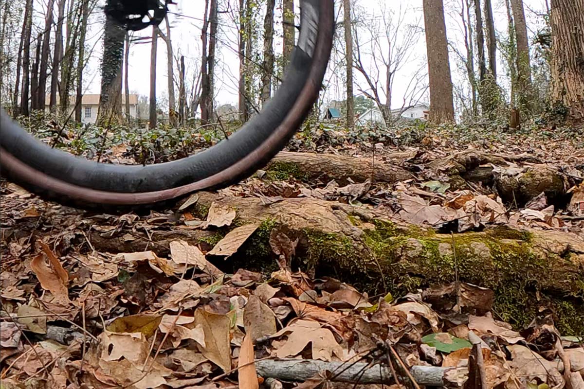 zipp tangente course  gravel tire review showing tires deforming over roots
