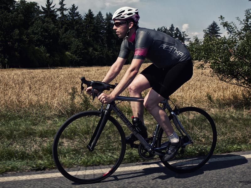 Festka_Zero_Chrome_lugged_carbon_fiber_road_bike_driveside_complete_bike_Cory_riding_alternate