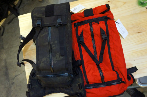 mission workshop dark camo and bright red Acre hydration packs