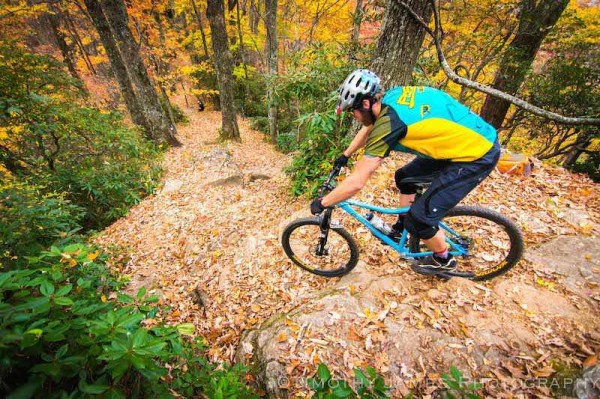 bikerumor pic of the day dropping into a super steep section of the Bennett Gap trail in the Pisgah Forest, NC, during peak leaf season