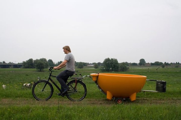 Dutch Tub being towed behind bicycle