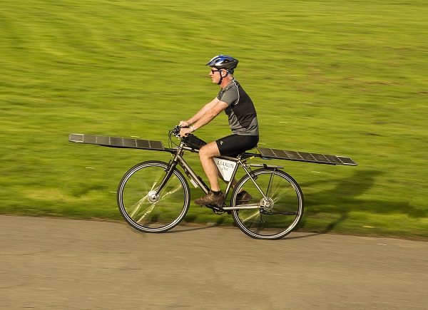 Maxun One solar e-bike, riding shot, left