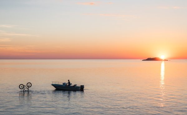 bikerumor pic of the day, Retrieving the rider and bike after a large rock roll then ended in Lake Superior at sunrise.