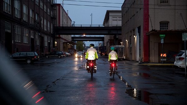 Shower's Pass hi-vis jackets, riders in dark