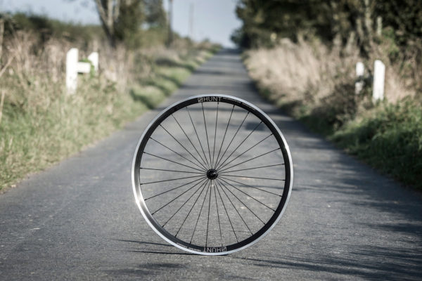 hunt-wheels_race-aero-superdura_ultra-durable-aero-heavy-rider-rim-brake-road-wheelset_in-the-lane