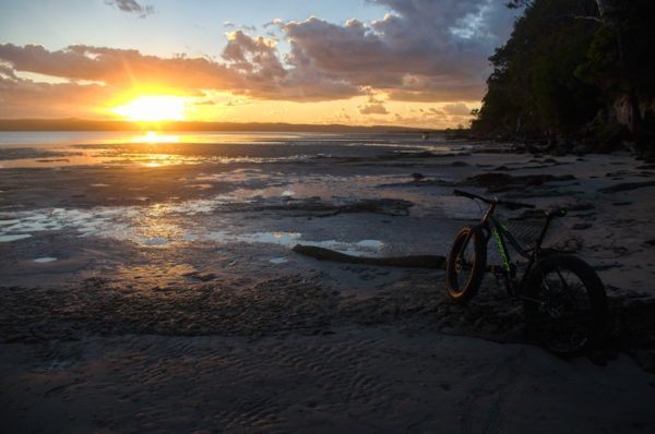 bikerumor pic of the day a picture of my new Norco Bigfoot and first fat bike. This picture was taken over Easter at low tide on the sand flats around Tinnanbar in Queensland, Australia with the sun rising over Fraser Island, the largest sand island in the world.