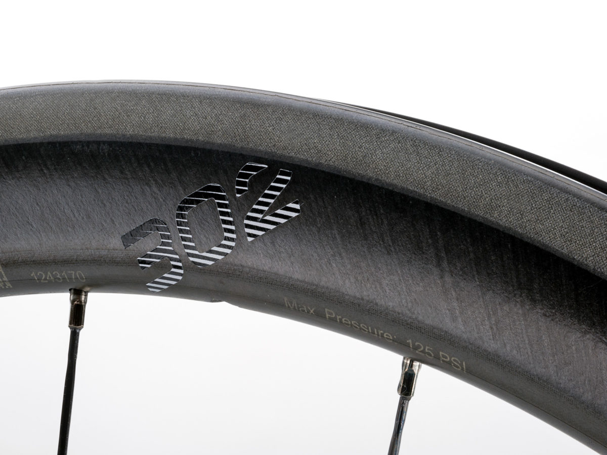 Zipp drops dimples & price for new 302 carbon clinchers, adds discs to 454 NSW