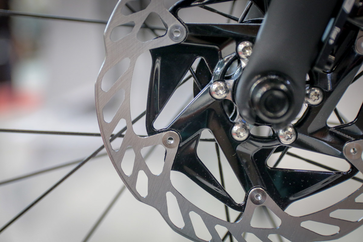 FSA WE road bike disc brake rotor with smaller holes to pass UCI safety tests