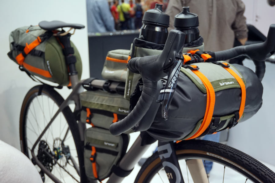 birzman bikepacking handlebar roll bag and stem-mount bottle bags