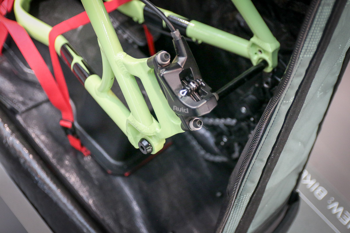 evoc packs a fat bike in Travel Bag XL, spare batteries in FR Trail E-Ride