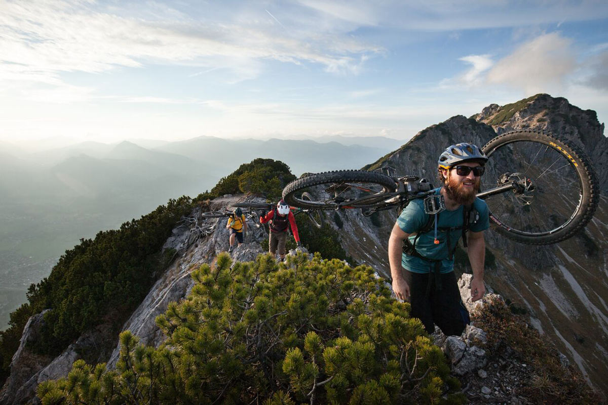PeakRider hangs your mountain bike on your hydration pack so you can hike-a-bike hands free