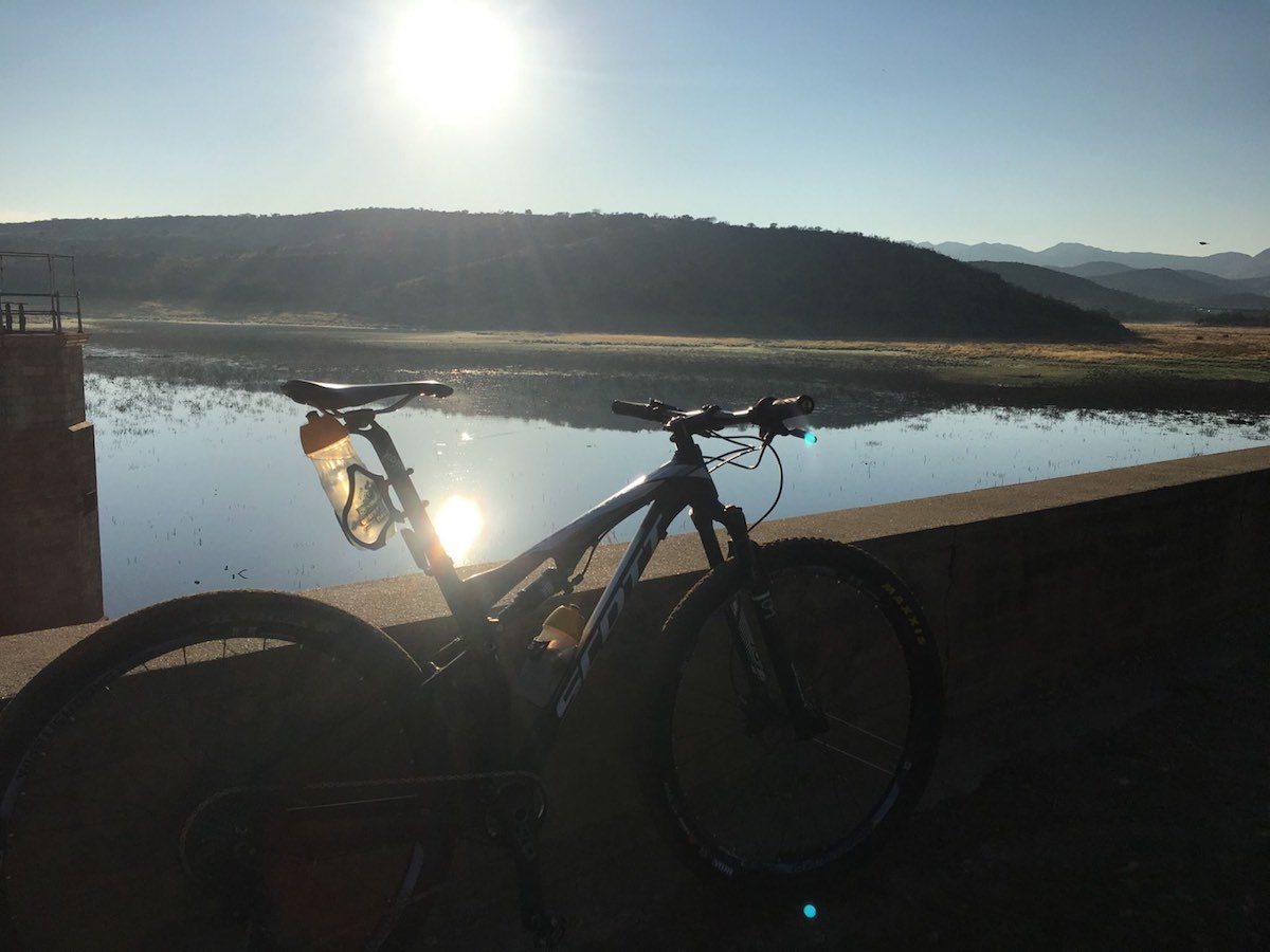 bikerumor pic of the day bike riding along avis dam in Windhoek, Namibia