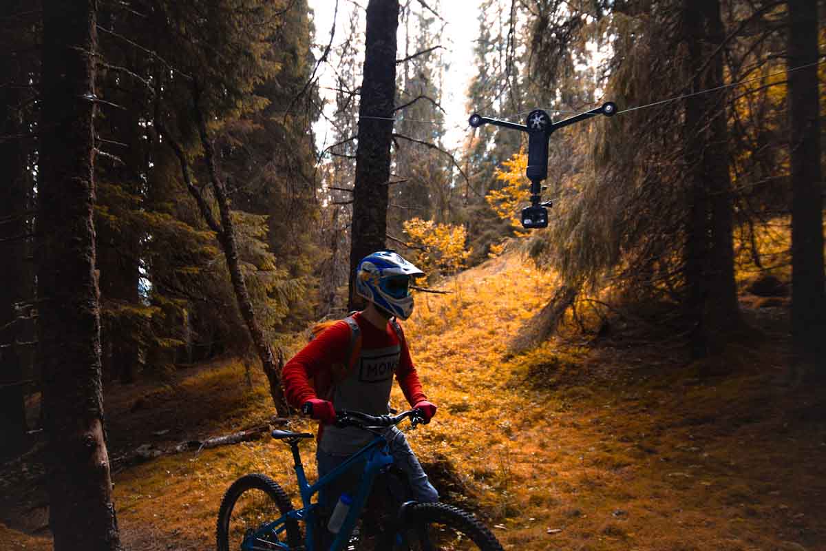 Wiral LITE cable cam, mountain biker in woods