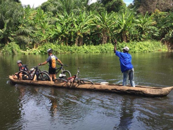 bikerumor pic of the day crossing the Bengo River with mountain bikes in Angola