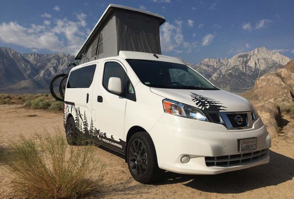 Recon Campers Nissan NC200 mini camper van with pop-top roof bed and fold flat bench seat bed offers great gas mileage for the vanlife