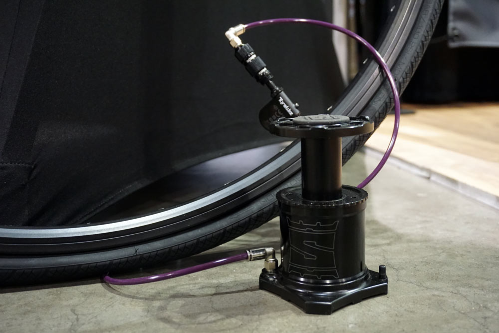 stompump is a mini bicycle tire foot pump that fits on your frame to fill tires faster than mini hand pumps