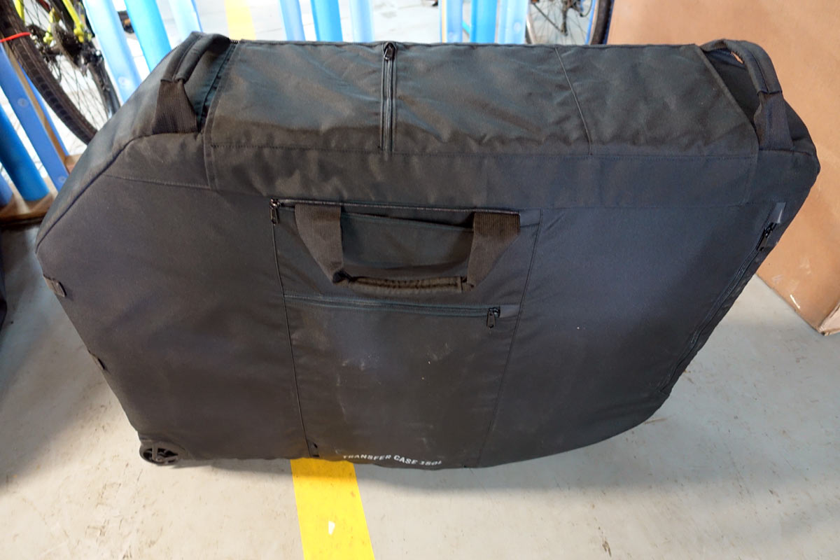 Post Carry standard size bicycle travel case review shows how to avoid airline oversize fees when traveling with your bike