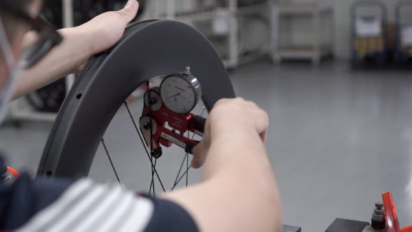 FSA tells whats the difference between handbuilt and machine built road bike and mountain bike wheels