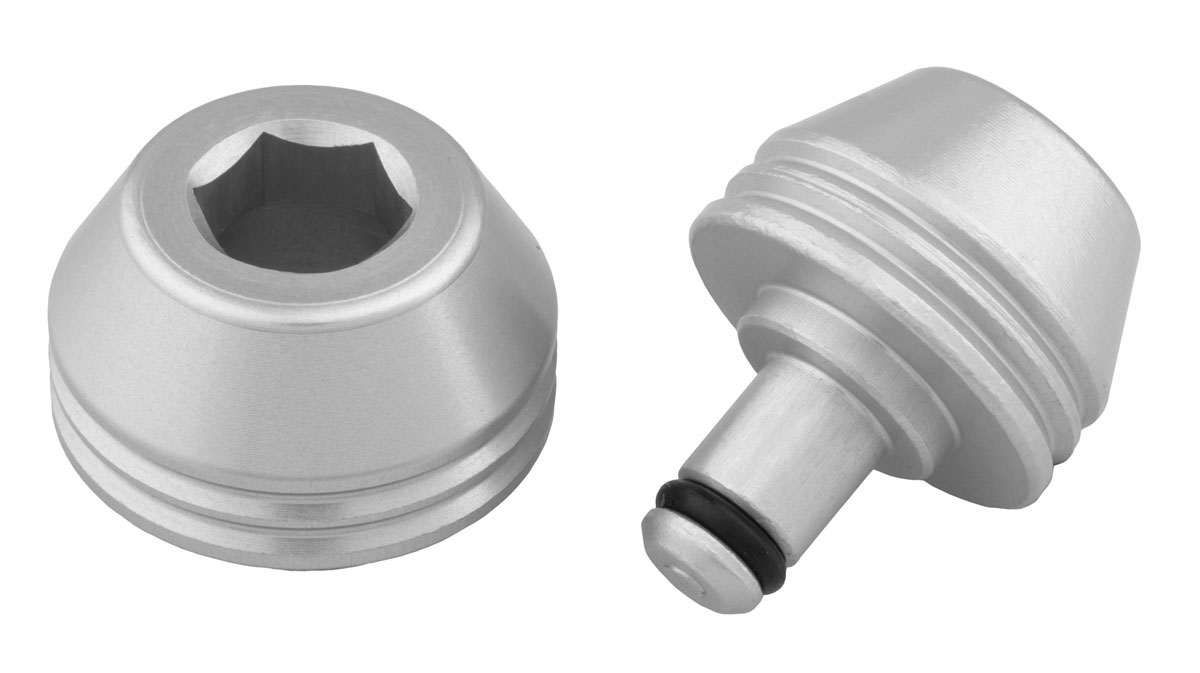 Replacement rear thru axle with axle cap for frame protection or trainer caps for indoor trainer use.