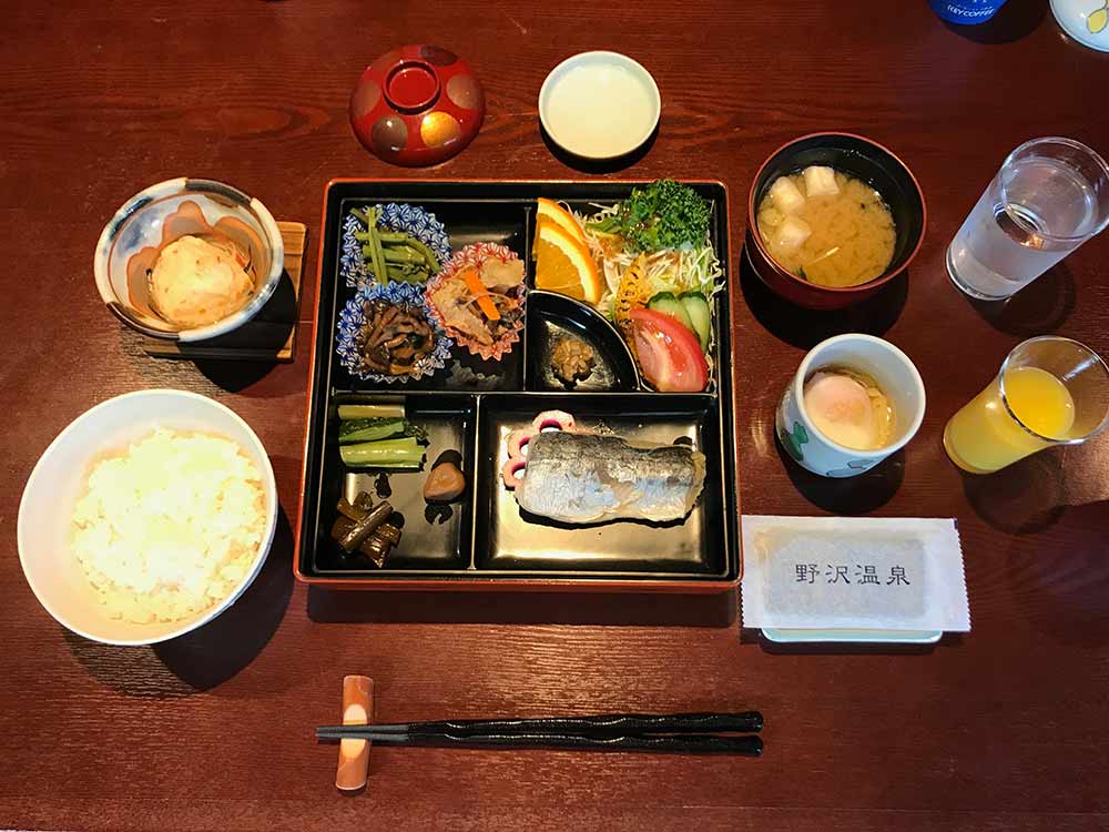 traditional japanese breakfast of fish and vegetables