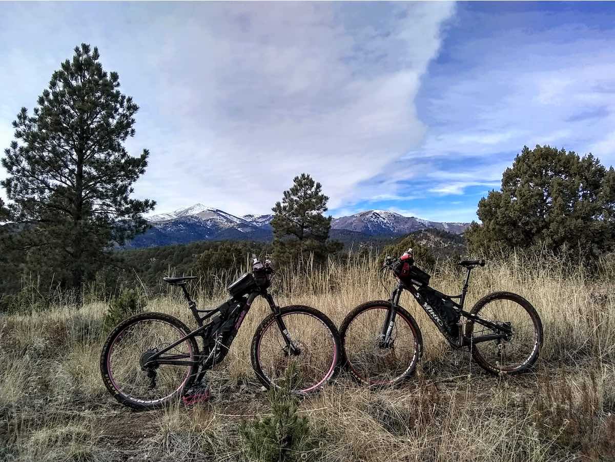bikerumor pic of the day biking Cedar Creek Trail system in the Lincoln National Forest in Ruidoso, NM. In the background is the Sierra Blanca mountain Peak, which is on the Mescalero Apache Indian Reservation.