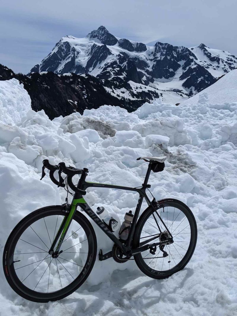 bikerumor pic of the day giant bicycle in Artist Point Washington State snow on the ground with mountain in the background