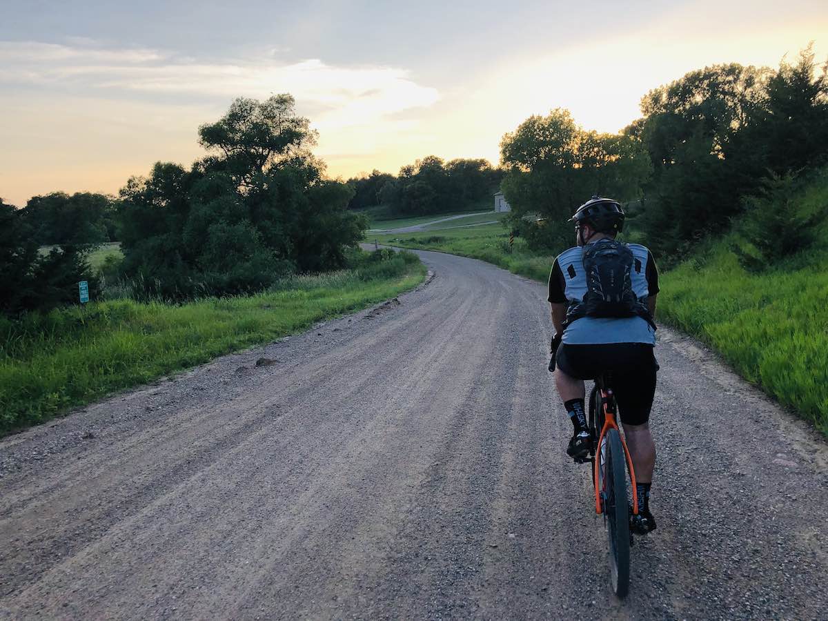 bikerumor pic of the day cyclist on gravel road in iowa.