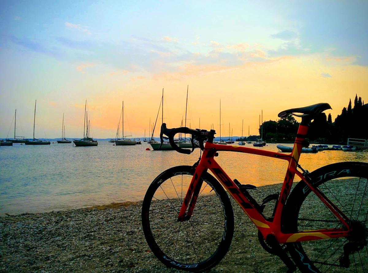 bikerumor pic of the day sunset on lago di garda, lake garda in northern italy.
