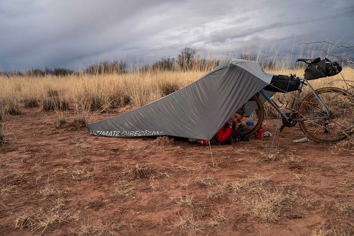 how to use your bike to hold up a tent or tarp and create an emergency shelter