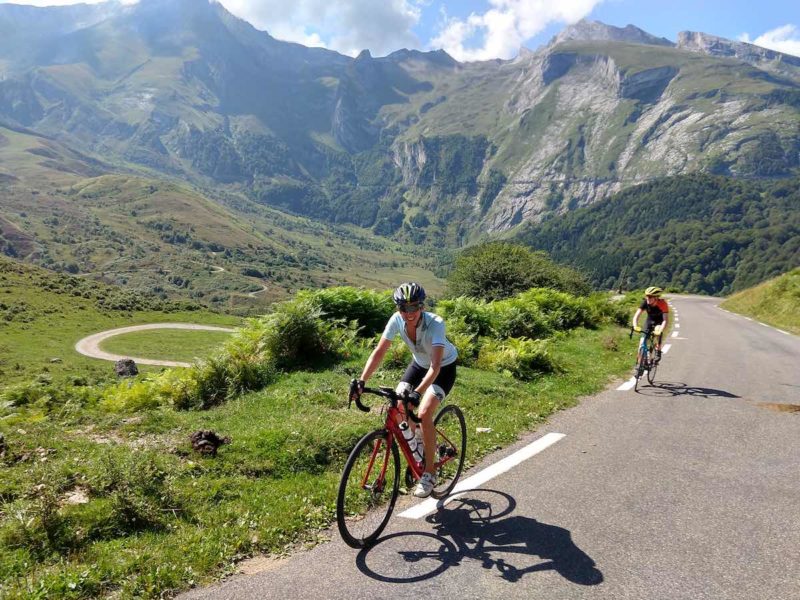 bikerumor pic of the day two cyclists riding up the Col du Soulor in the French Pyrenees.