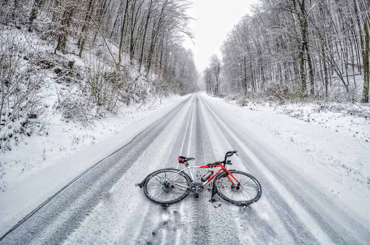 bikerumor pic of the day Hungary, Miskolc-Garadna, bicycle laying on street covered in a light dusting of snow.