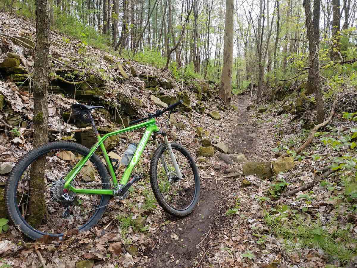 bikerumor pic of the day orbea mountain bike on a dirt mountain bike trail in the woods of vultures knob trail system in wooster ohio.