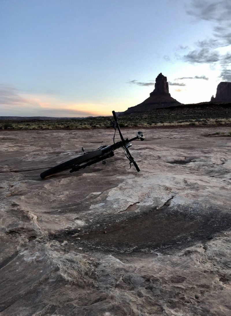 bikerumor pic of the day bicycle lying on its side on white rim trail in canyonlands national park utah looks like the surface of the moon.