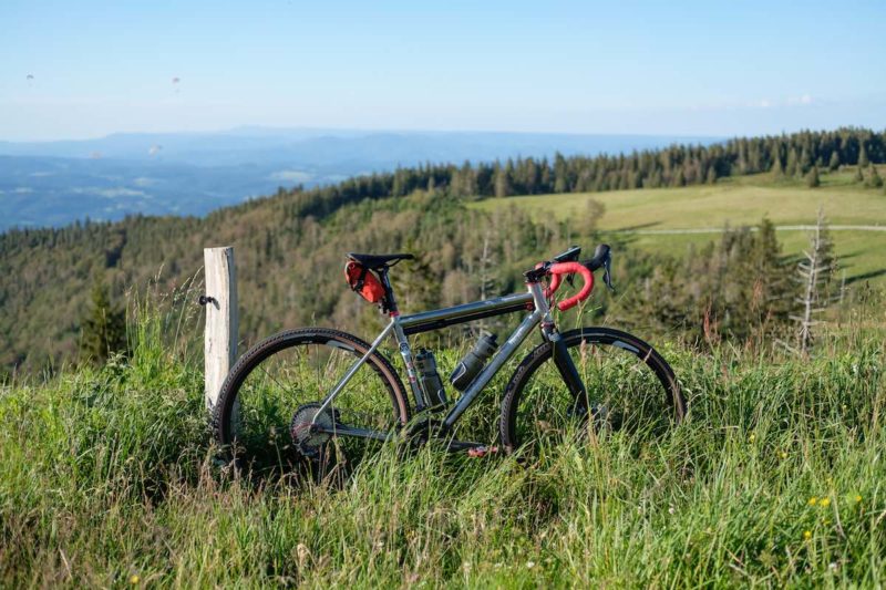bikerumor pic of the day Kandel mountain in germany a bicycle in a grassy field atop a mountain.