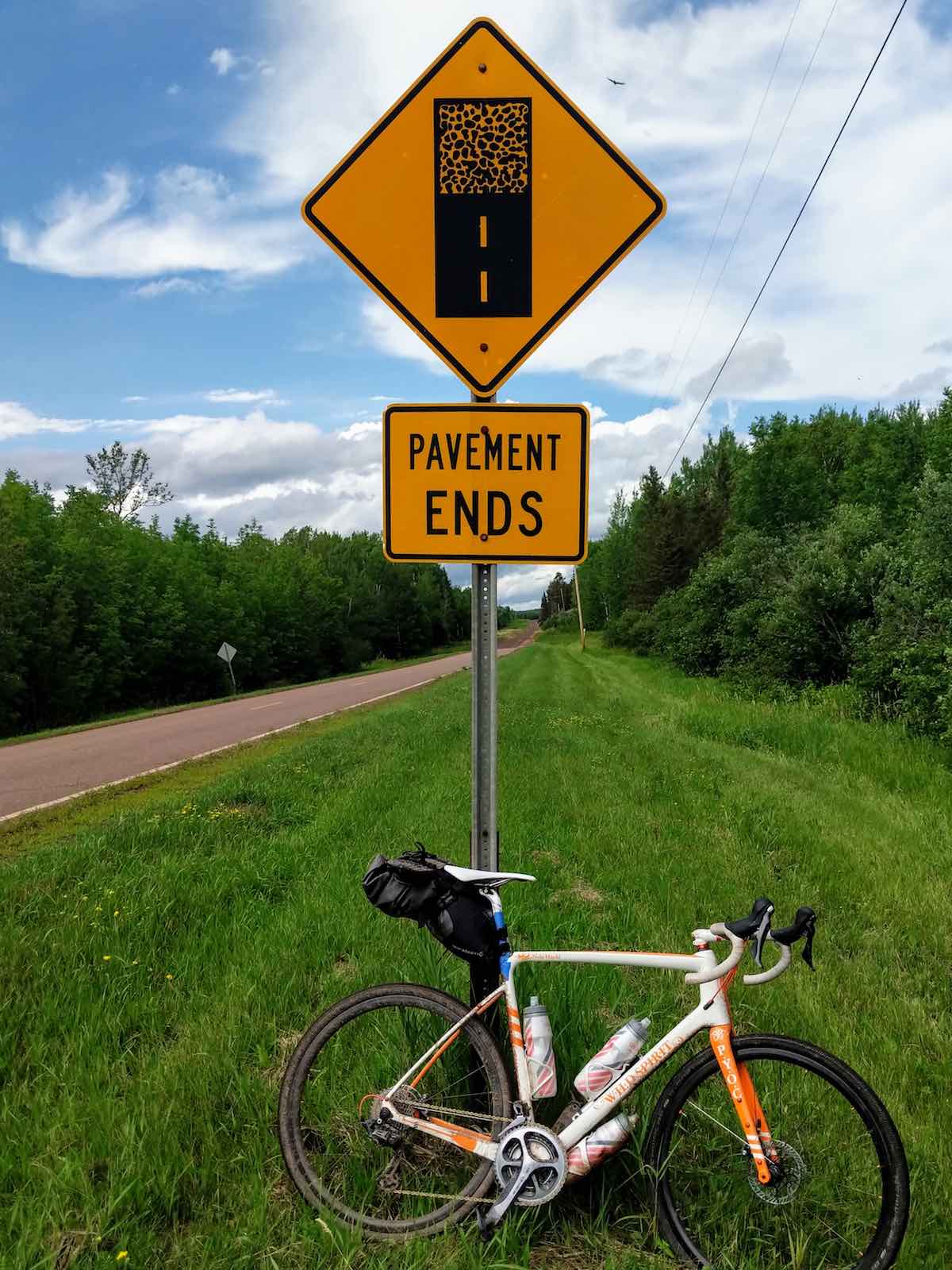 bikerumor pic of the day gravel bike leaning against a road sign that says road ends outside of Two Harbors, MN.